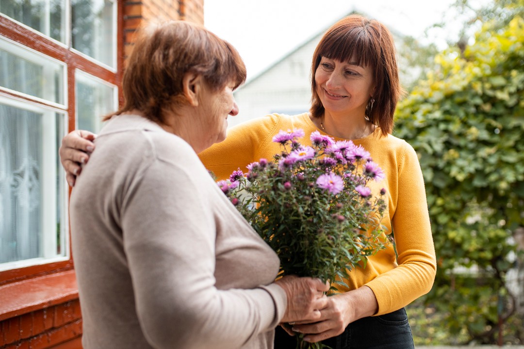 person-helping-their-elder-neighbour
